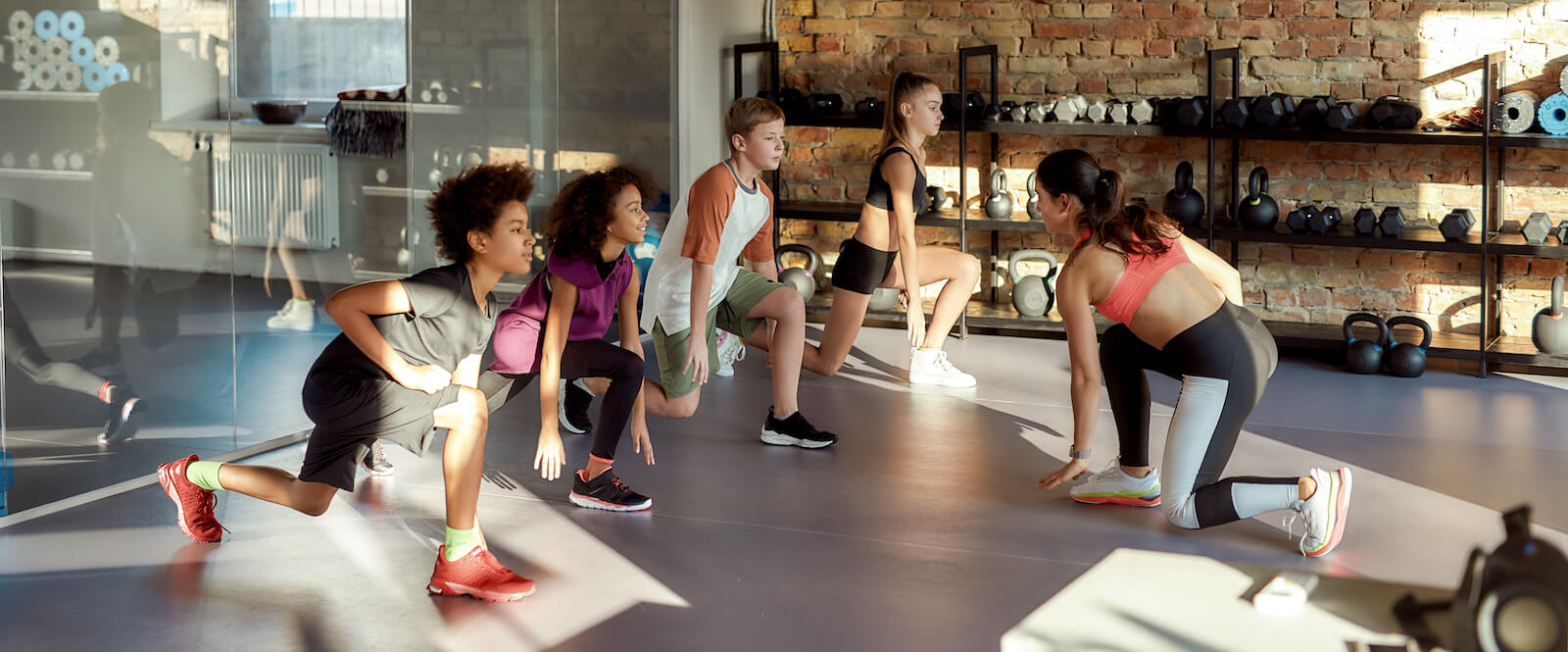 Athletes learning exercises for injury prevention